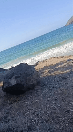Woman spends evening taking selfies on Venezuelan rocky coastline