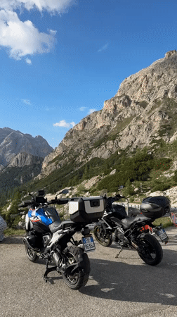Cars, bikes, and hikers out in the Dolomites near Cortina