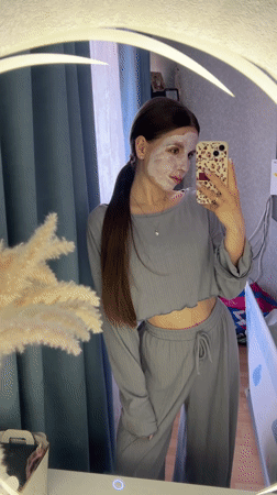 Woman documents skincare routine with mirror selfie in Klin