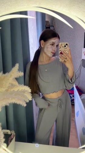 Woman documents skincare routine with mirror selfie in Klin