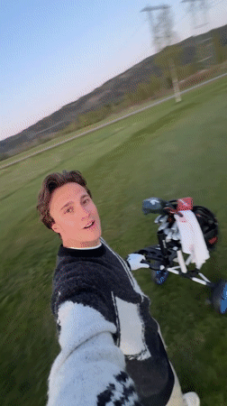 Golfer films selfie video at Sylling course during evening