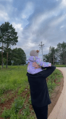 Family afternoon walk through a Russian village with a baby