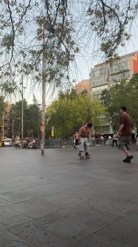 Evening street life and skateboarding in Barcelona squares