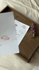Person creates lipstick kiss art collection in Krasnodar bedroom