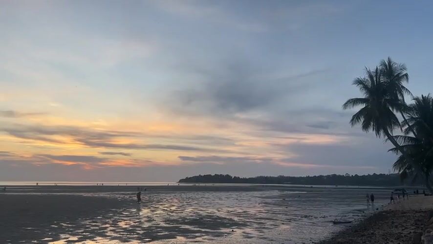 Sunset beach walk documented at Baan Sri Thanu, Thailand