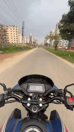 Motorcycle ride documented through tree-lined Nasirabad streets