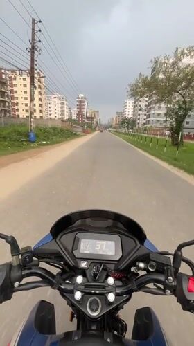 Motorcycle ride documented through tree-lined Nasirabad streets