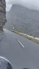 Wet mountain road through Gemur's rugged Himalayan terrain