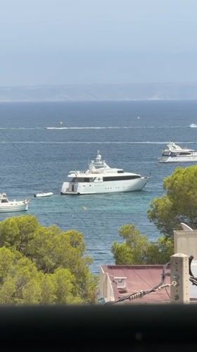 Yachts on a clear blue bay in Palmanova, Spain