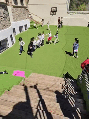 Children play group game on Barcelona playground