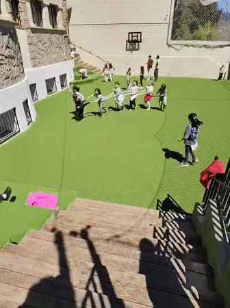 Children play group game on Barcelona playground
