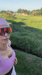 Woman films selfie video near Ubud rice fields