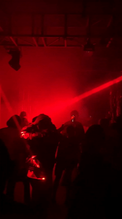 Industrial venue hosts gathering under red lights in Almaty