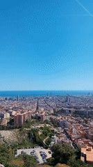 Tourist captures panoramic aerial views of Barcelona from hilltop