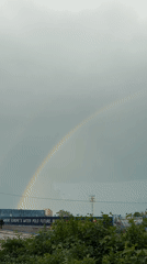 Double rainbow photographed near Varna 2026 water polo billboard