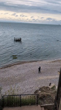 Visitor documents leisurely morning at Odesa pier with snacks