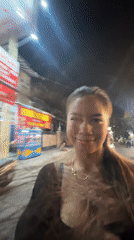 Woman films herself walking on North Jakarta street