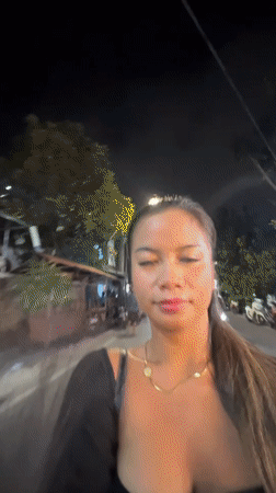 Woman films herself walking on North Jakarta street