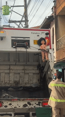 Garbage truck spotted on residential street in Guarne, Colombia