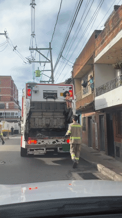 Garbage truck spotted on residential street in Guarne, Colombia