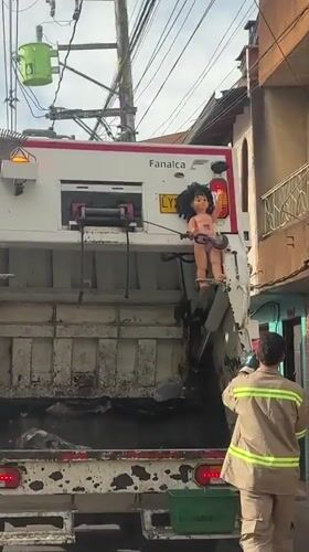 Garbage truck spotted on residential street in Guarne, Colombia