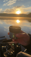 Early morning fishing session captures peaceful lakeside sunrise moment