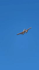 Orange and white seaplane lifting off near Fethiye coast