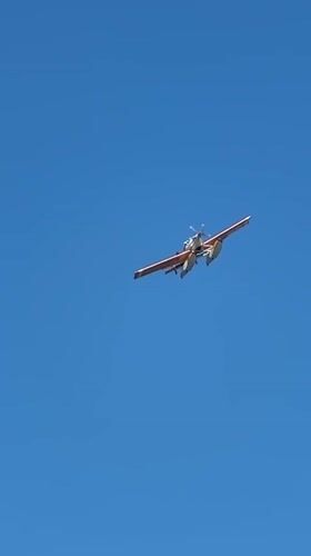 Orange and white seaplane lifting off near Fethiye coast