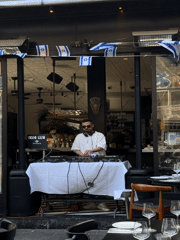 DJ performs outdoor set at flag-decorated Tel Aviv restaurant