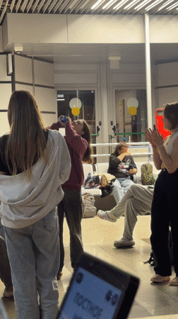 Woman finishes drink from plastic container in Adler