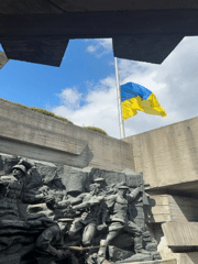 Ukrainian flag at half-mast over military monument in Kyiv