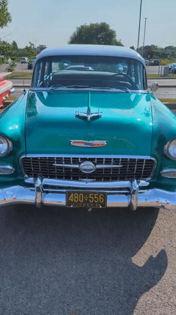 Classic American cars on display in a Laval parking lot