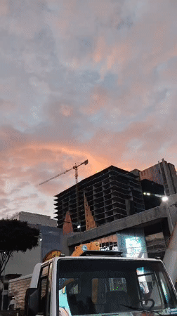 Construction site with crane observed during sunset in Caracas