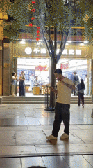 Evening street life captured near Beijing's Zhengyangmen Gatehouse