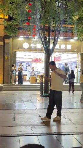 Evening street life captured near Beijing's Zhengyangmen Gatehouse