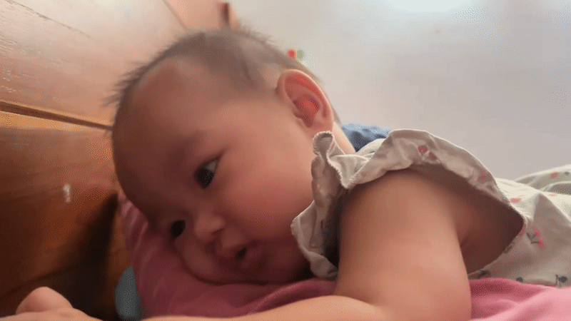 Baby resting on a pink pillow in West Jakarta