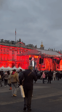 Crowd gathers at illuminated Winter Palace event in Saint Petersburg
