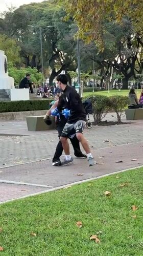 Two men boxing in Buenos Aires park