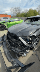 BMW iX damaged, repair work documented at workshop