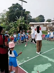 Neighborhood Independence Day event with kids on a court in Taban