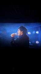 Cinema audience watches concert performance on large screen
