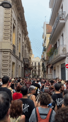 Drumming and dancing in a packed Barcelona street