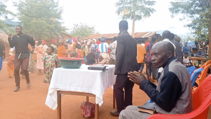 Elderly man dances barefoot in rural Congo village