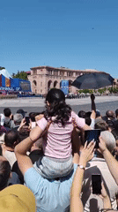 Crowd gathers in Yerevan to watch parade on outdoor screen
