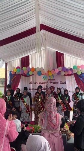Quran graduation ceremony with sashes and medals, Sukabakti