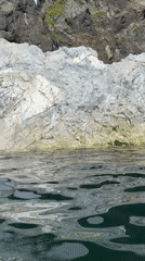 Rugged Russian coastal shoreline explored by boat