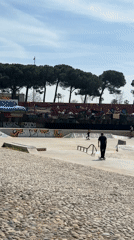 Skateboarders gather at graffiti-covered Barcelona park on sunny morning