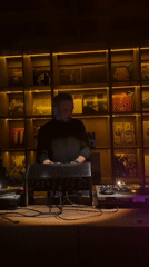 DJ setup and ambient venue details with aquarium cutaways