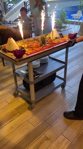 Chefs present sparkler-adorned charcuterie at Varna restaurant poolside