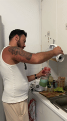 Kitchen blending and urban buildings documented in Lisbon evening